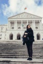 Female tourist standing in front of the Parliament of Portugal, Assembly of the Republic