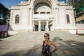 Female tourist is standing in front of Saigon Opera House of Ho Chi Minh City Royalty Free Stock Photo