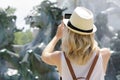 Female tourist taking picture fountain