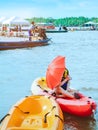 Female Tourist travel by raft boats to relax and kayaking to watch the red hawks and mangrove forest in the sea  at Bang Chan The Royalty Free Stock Photo