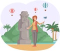 Female tourist travels, takes selfie near stone figure. Woman in journey on tropical island