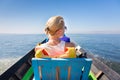 Female tourist travels by traditional boat. Royalty Free Stock Photo