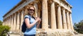 Female tourist visits Temple of Hephaestus, Athens, Greece Royalty Free Stock Photo