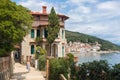 Female tourist walking along Adriatic sea coast relaxing on vacation in Moscenicka Draga, Istria, Croatia. Royalty Free Stock Photo