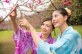 Female tourists friends taking picture