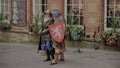 Female Tourists has picture taken with Scottish Clansman Royalty Free Stock Photo