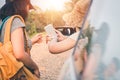 Female tourists inquire about directions from people in the area to get the correct aim