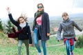 Female tourists reaching top - finishing long uphill trip Royalty Free Stock Photo