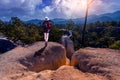 Female tourists stand on the viewpoint of Pai Canyon in Pai District, Mae Hong Son Province, Thailand