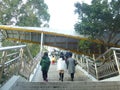 Female tourists walk on the pedestrian bridge