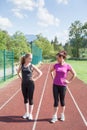 Female Track Competitors Glaring at Each Other Royalty Free Stock Photo