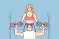 Female trainer help male client in gym