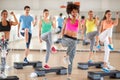 Female trainer lead group training in fitness center Royalty Free Stock Photo