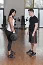 Female trainer working with her trainee with weights Royalty Free Stock Photo