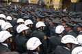 Female transit police watching a parade