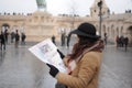 Female travel alone to see sightsee. Girl look at the map in old city