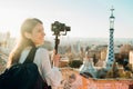 Female travel photographer/videographer and bloger using camera with gimbal stabiliser crane in Barcelona,Spain.Travel photography