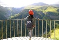 Female Traveler Admiring the View of Devil`s Valley from Russia-Georgia Friendship Monument in Gudauri Town Royalty Free Stock Photo