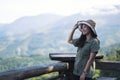 A female traveler with a beautiful green mountains landscapee Royalty Free Stock Photo