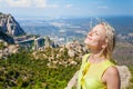 Female traveler enjoying the views from the mountains of Montserrat in Spain