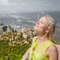 Female traveler enjoying the views from the mountains of Montserrat in Spain