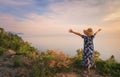 The female traveler is happy and relaxed on the tourist route