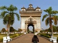 Female Traveler Heading to the Gate of Triumph or Patuxai in the Citycentre of Vientiane, Laos Royalty Free Stock Photo