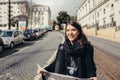 Female traveler holding and reading tourist map Royalty Free Stock Photo