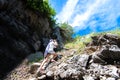 Female traveler photographing mountain