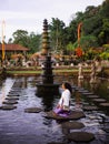 Solo Female Traveler Admiring Main fountain at Tirta Gangga, Bali