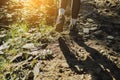 Female traveler sport shoes on trail walking in mountains, outdoor activity. Woman hiking, adventure and exercise Royalty Free Stock Photo