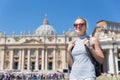 Woman on St. Peter`s Square in Vatican in front of St. Peter`s Basilica. Royalty Free Stock Photo