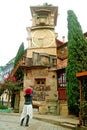 Female Traveler Taking Photos of the Leaning Clock Tower, Tbilisi, Georgia