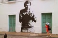 Female Traveler Taking the Picture of Impressive Street Art in Buenos Aires, Argentina