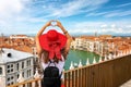 Female traveler tourist over the skyline of Venice, Italy