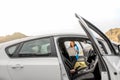 Female traveler with toursit map near the car Royalty Free Stock Photo