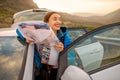 Female traveler with toursit map near the car Royalty Free Stock Photo