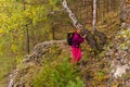 Female traveler trekking in the autumn forest Royalty Free Stock Photo