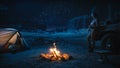 Female Traveler Watching Night Sky while Camping in the Canyon by Campfire. Amazing Campsite view of