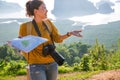 Female travelers are holding a map with money fifteen baht. The concept of tourism has little money can travel. The girl who Royalty Free Stock Photo