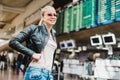 Female traveller checking flight departures board. Royalty Free Stock Photo