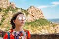 A female traveller enjoys the view from the mountains of Montserrat in Spain