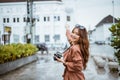 female traveller with long brown hair pointing on the building Royalty Free Stock Photo