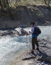 Female trekker standing on the edge of the river