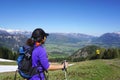 Female trekker standing on with mountain landscape background