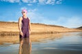 Female triathlete entering the water