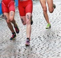 Female triathlon feet and legs