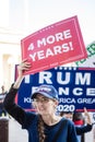 A Woman Holds Up a Sign Reading Four More Years at a Stop the Steal Rally