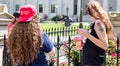 Female Trump Supporters Stare Back at Man Across Barrier