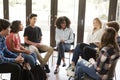 Female Tutor Leading Discussion Group Amongst High School Pupils Royalty Free Stock Photo